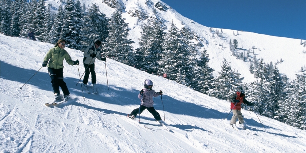 Family skiing on piste