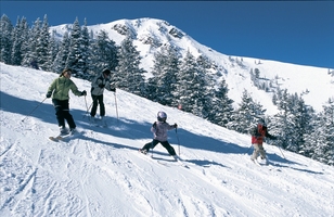 Family skiing on piste